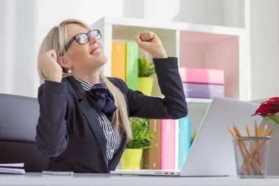 person pointing at a computer screen